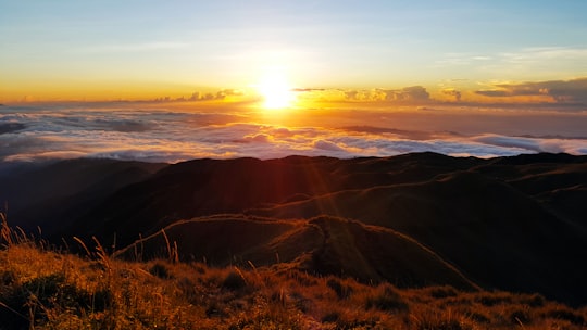 mountain range under sunlight in Mount Pulag Philippines