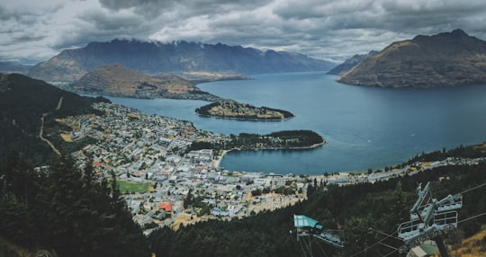 aerial photo of mountains and body of water in Skyline Queenstown New Zealand