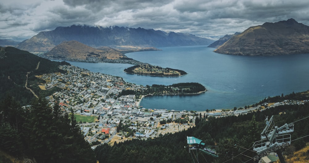 aerial photo of mountains and body of water