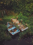 blue and brown canoe beside dock
