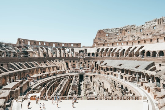 group of people on landmark in Colosseum Italy