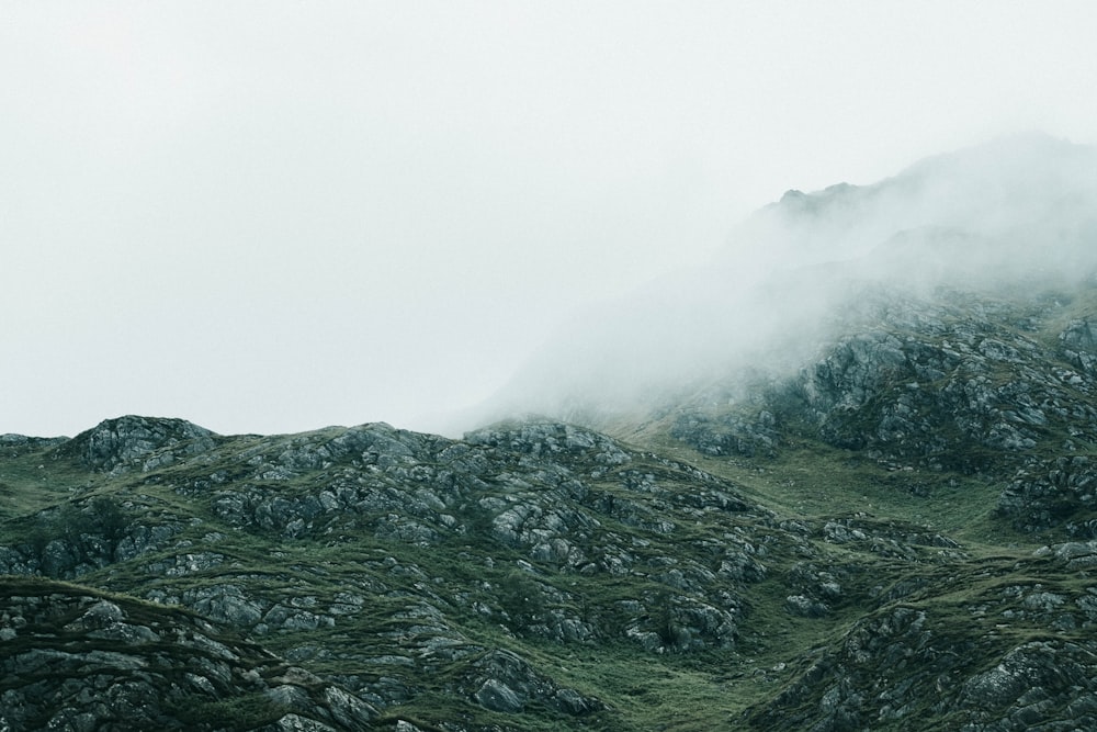 green mountain under cloudy sky at daytime