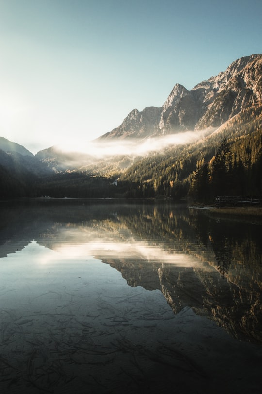 landscape photography of body of water against mountain in Antholzer See Italy