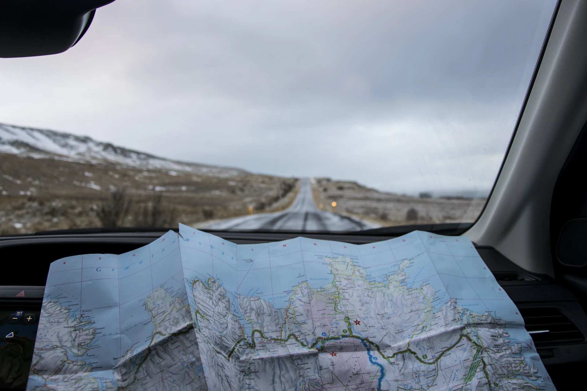 An unfolded road map inside a car, ready for planning a journey