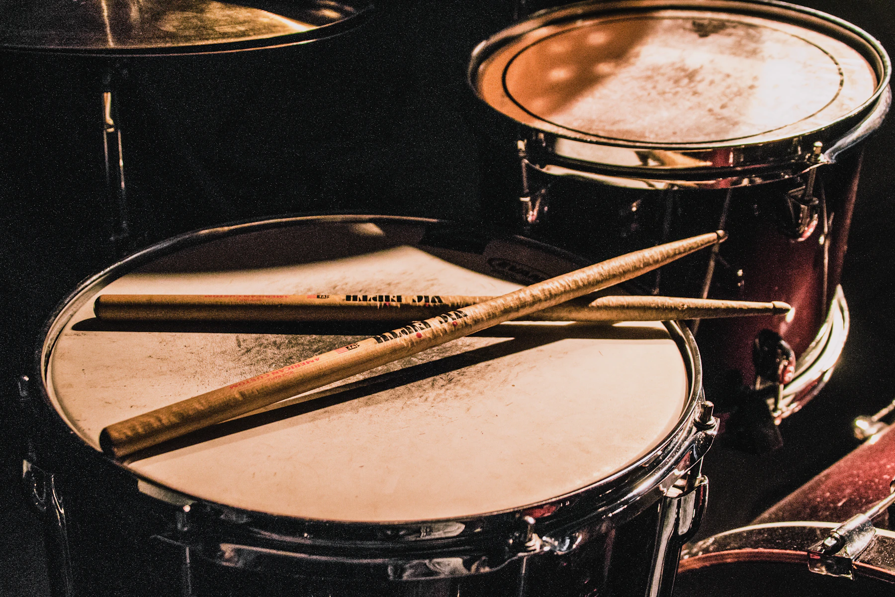 Drum kit with sticks on the head