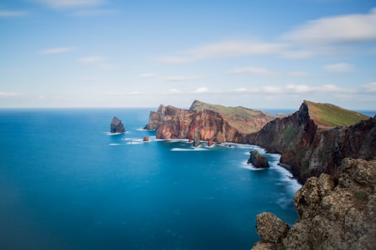 landscape photography of blue body of water with island in Madeira Portugal