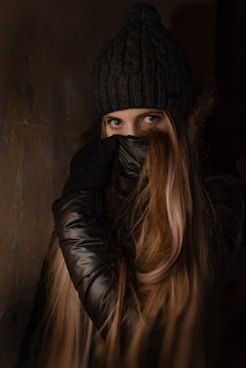woman covering her face using jacket onlyfans