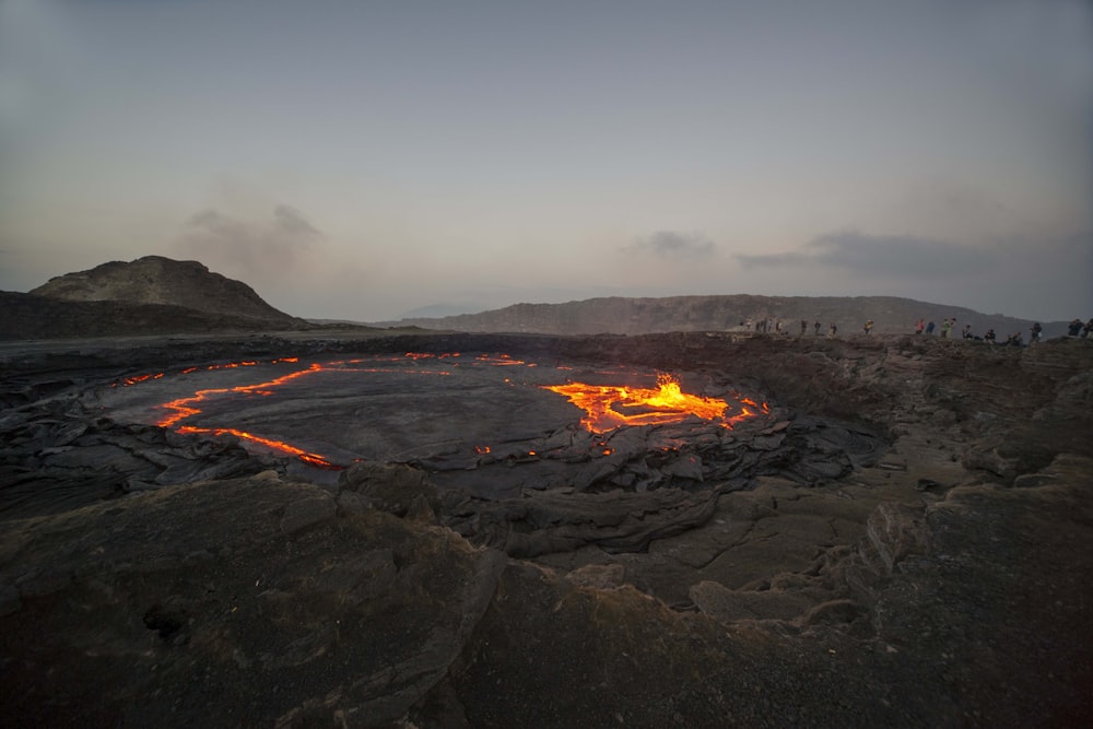 burned hill under gray and white sky