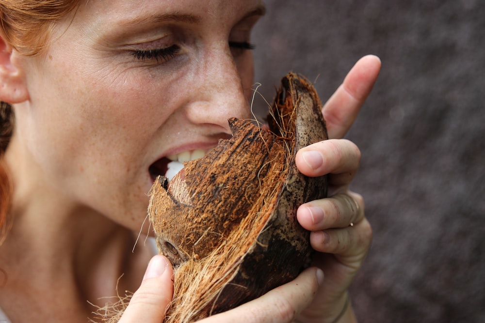 woman eating coconut meat