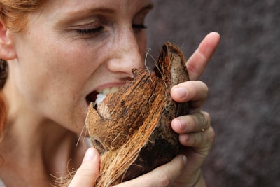 woman eating coconut meat taste zoom background