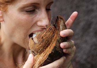 woman eating coconut meat