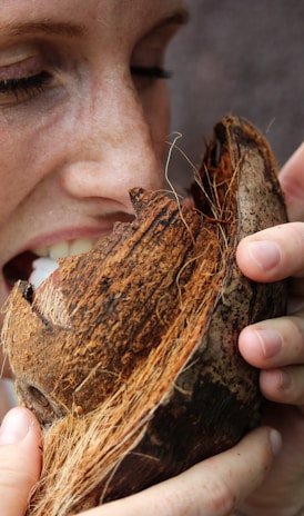 woman eating coconut meat