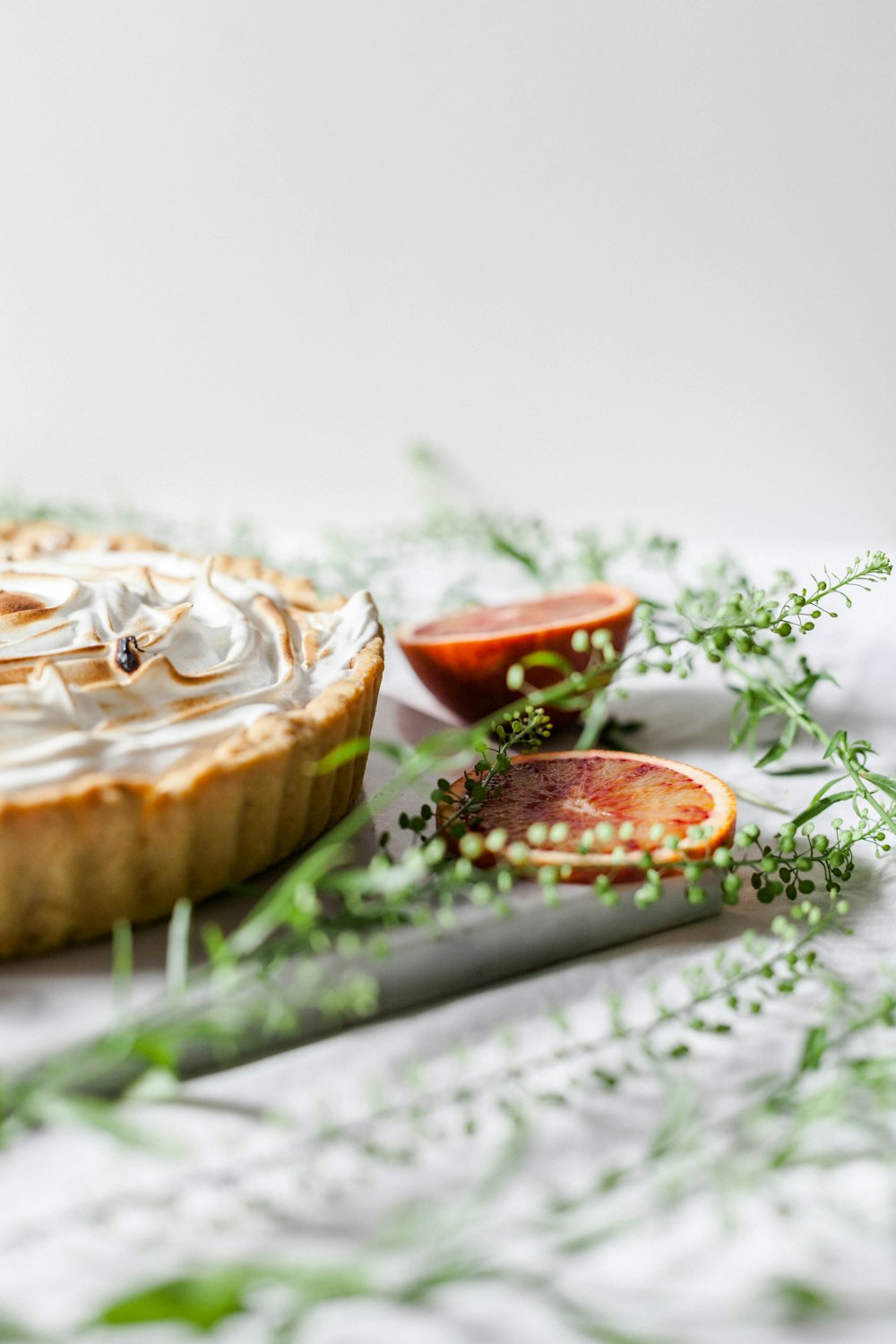 pie near sliced fruits