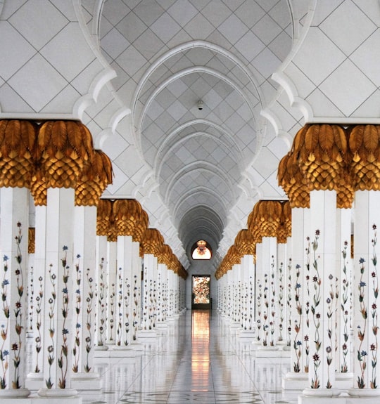 photo of white columns and marble tiles in Sheikh Zayed Mosque United Arab Emirates