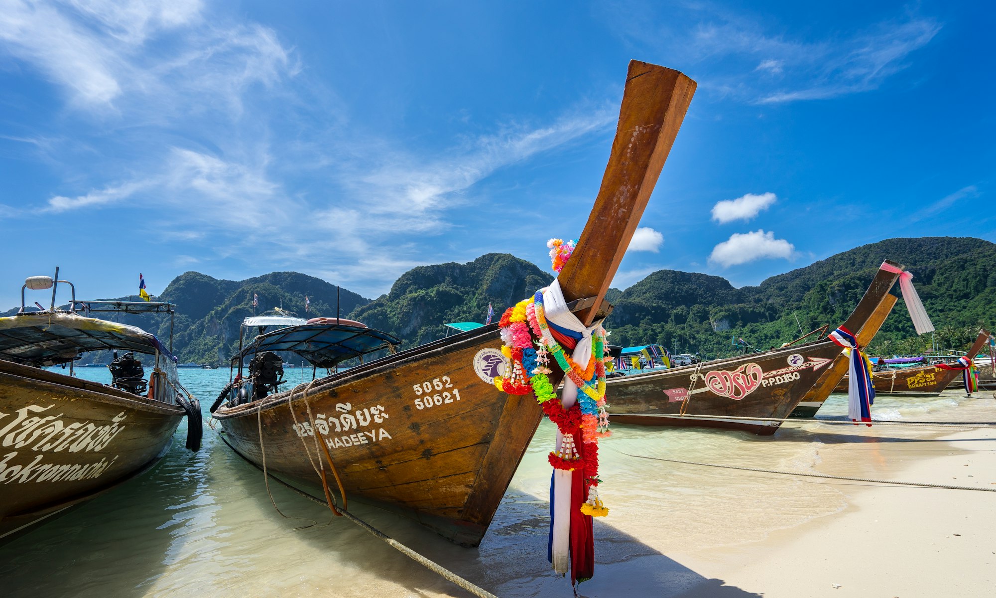 Wandering the beach in the morning, I captured this one of the long tail boats waiting for a busy day of tourist action on: Koh Phi Phi, Thailand 

View more on my website: http://www.frankieboyphotography.com/

Check out my instagram: instagram.com/fr33water/