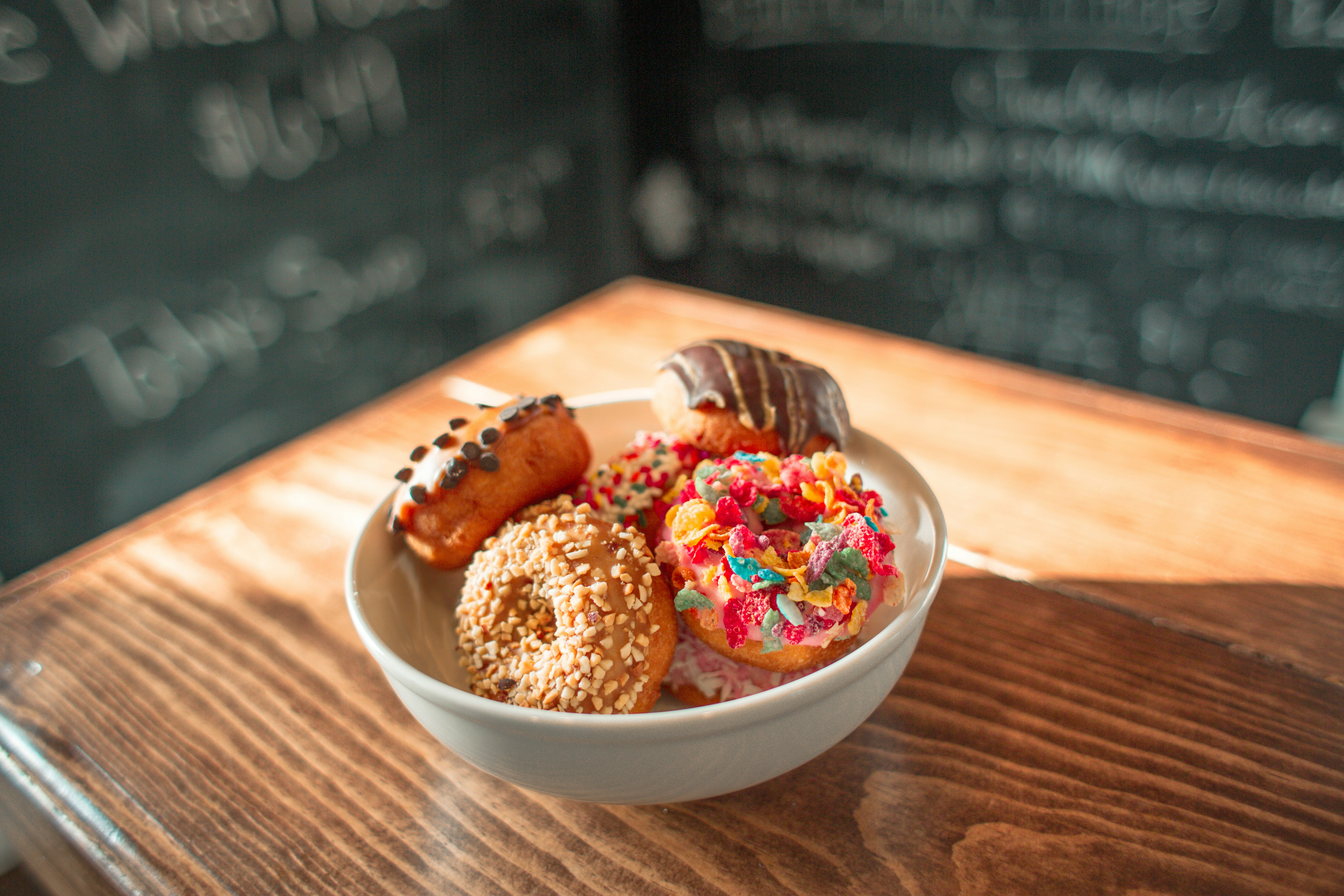 doughnuts in round white ceramic bowl