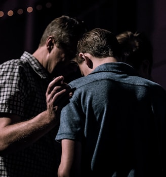 men touching each other's foreheads