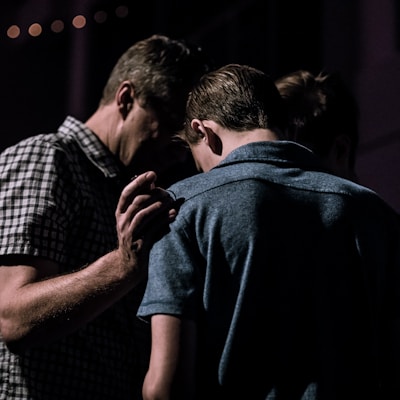 men touching each other's foreheads