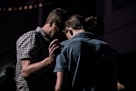 men touching each other's foreheads