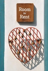 closeup photo of room for rent sign