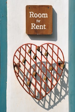 closeup photo of room for rent sign