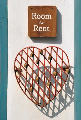 closeup photo of room for rent sign