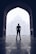 silhouette photography of man standing near door in front of mosque