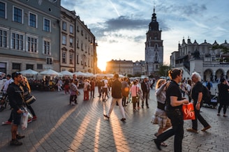 people walking on street near concrete buildings