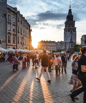 people walking on street near concrete buildings