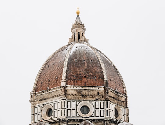 red dome church at daytime in Museum of Opera of Saint Maria of Fiore Italy