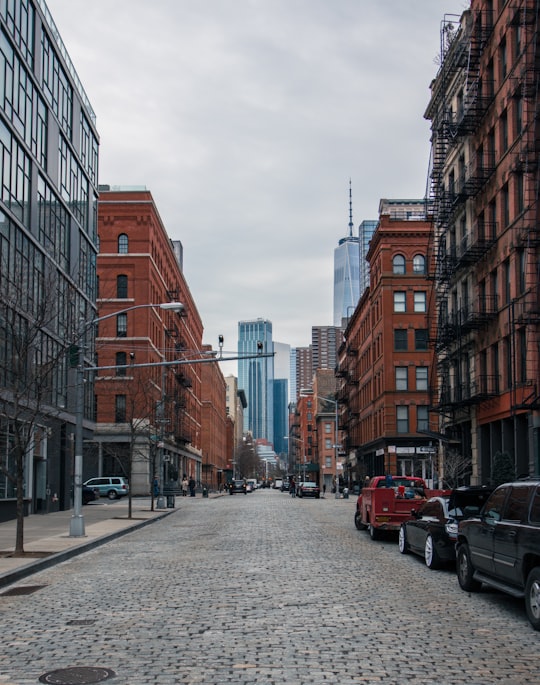 vehicles on roadway between high rise buildings at daytime in Tribeca United States