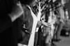 grayscale photo of lined-up standing people
