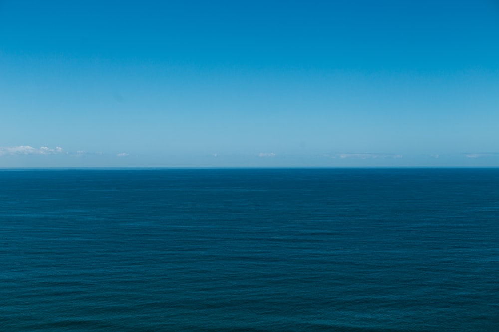 blue ocean under blue sky during daytime