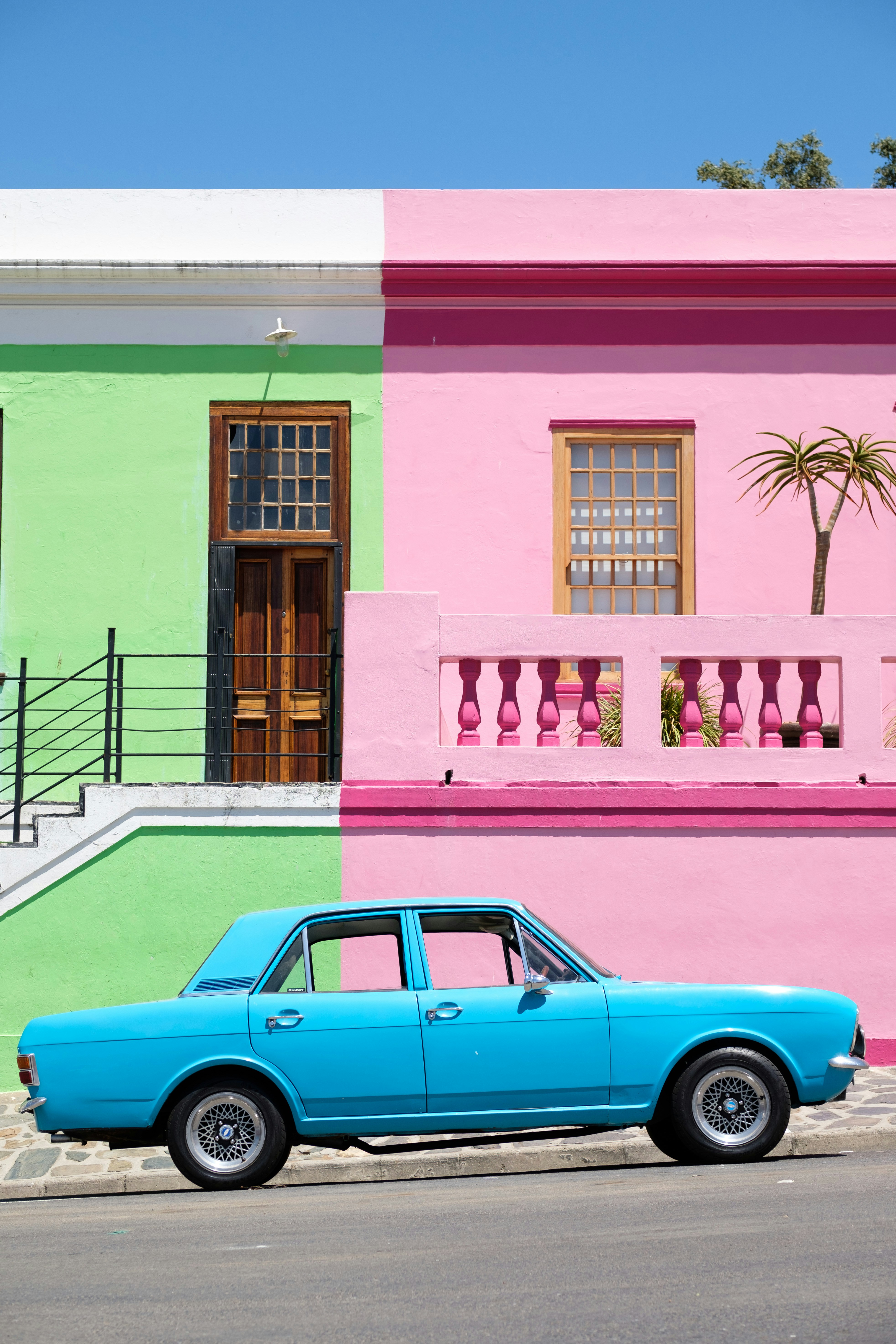 A colorful portait of an old blue sedan vehicle in the Bo-Kaap. Love my work? buy me a coffee ☕ PayPal - a.smit@mac.com