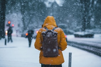 person wearing jacket and backpack