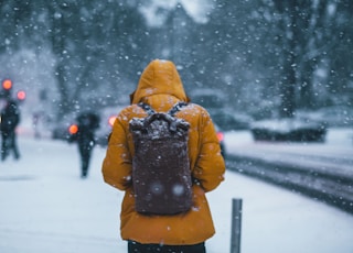 person wearing jacket and backpack