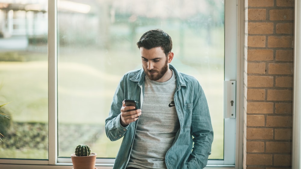 man using his smartphone