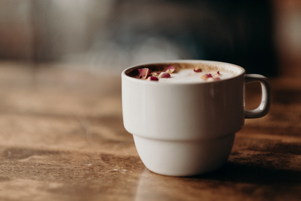 white ceramic mug filled with coffee at daytime