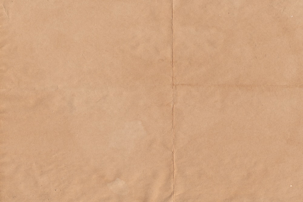 a piece of brown paper with a white background