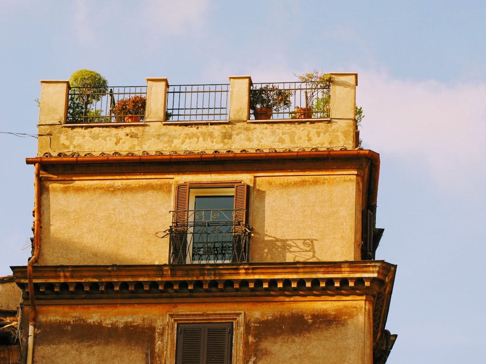 beige and brown concrete building under blue sky