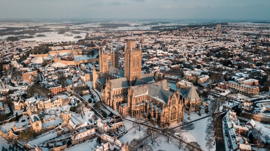 brown cathedral during daytime in Lincoln Cathedral United Kingdom