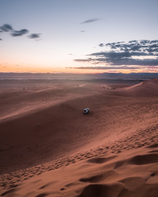 car running on desert in Merzouga Morocco