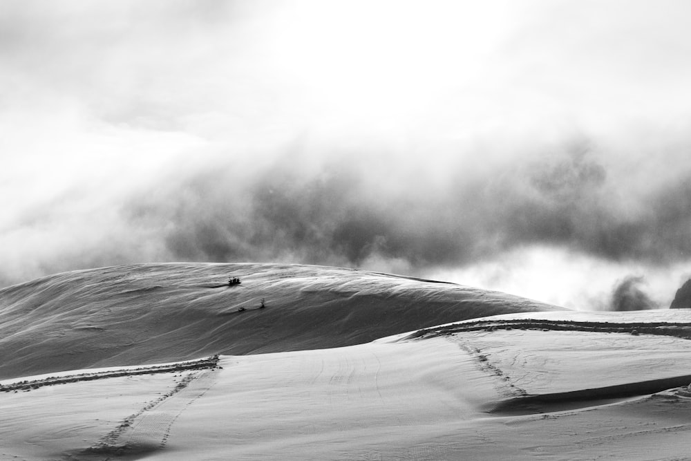 grayscale photo of sandstorm in desert