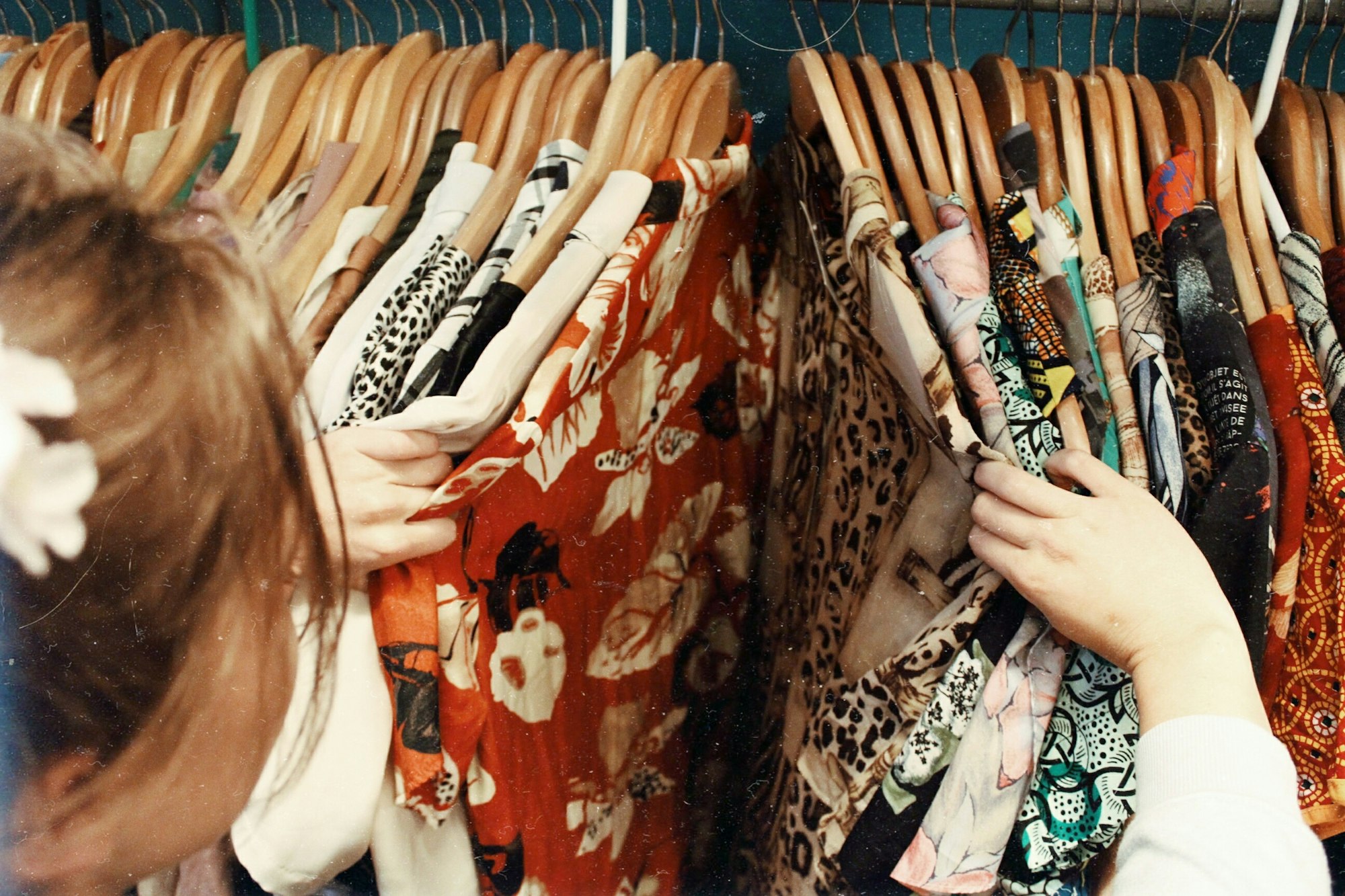  A woman shopping for clothes in a thrift store