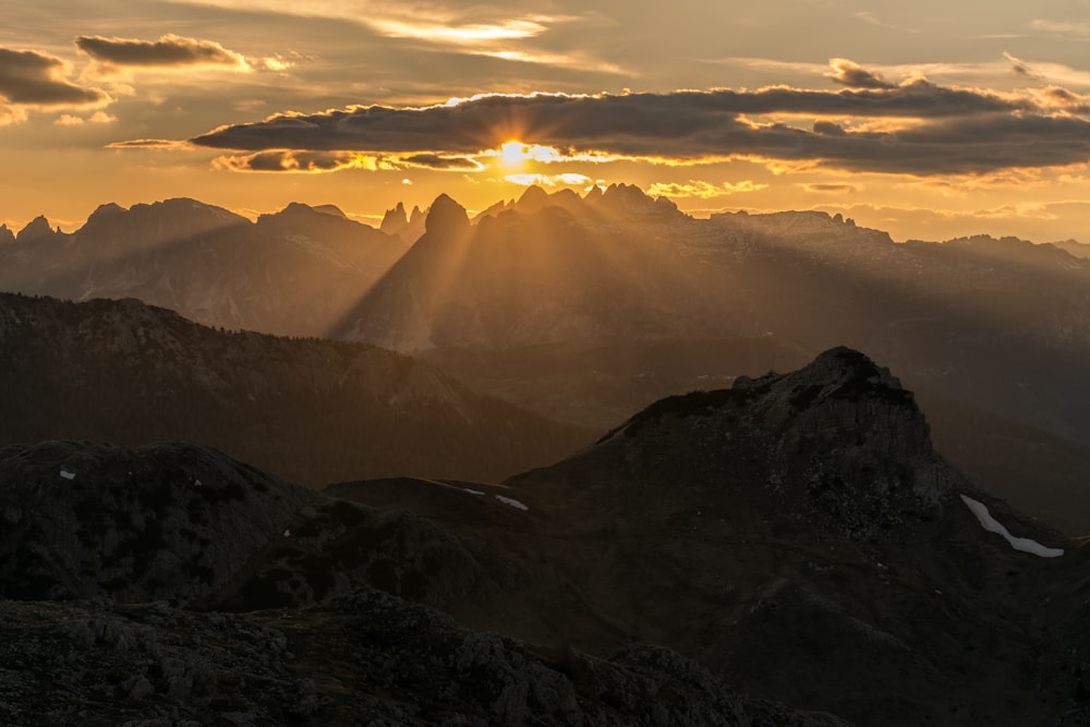 photo of rock mountains during sunrise