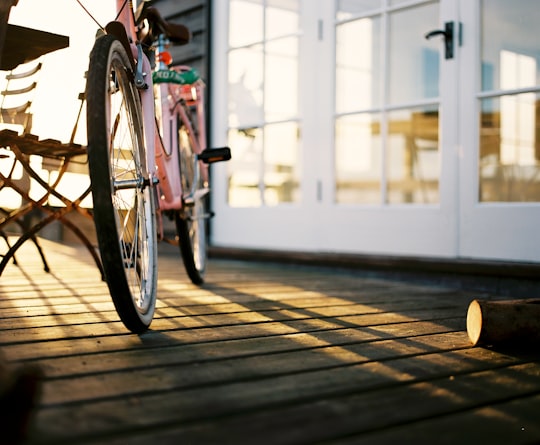 pink rigid bike near building in Walberswick United Kingdom