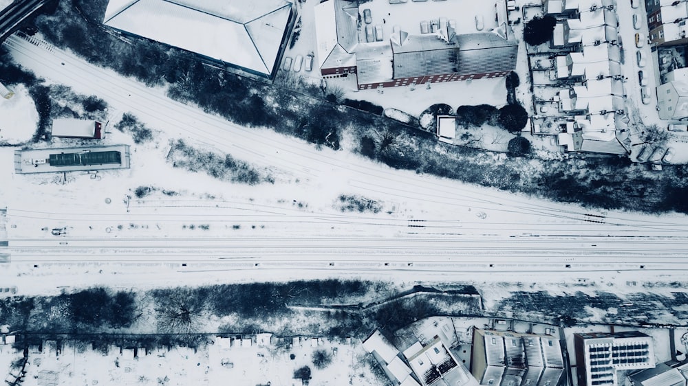 bird's eye view photo of houses and building filled with snow