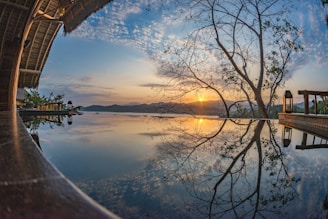 Sunset over Market Lake with rustic farm gazebo in foreground
