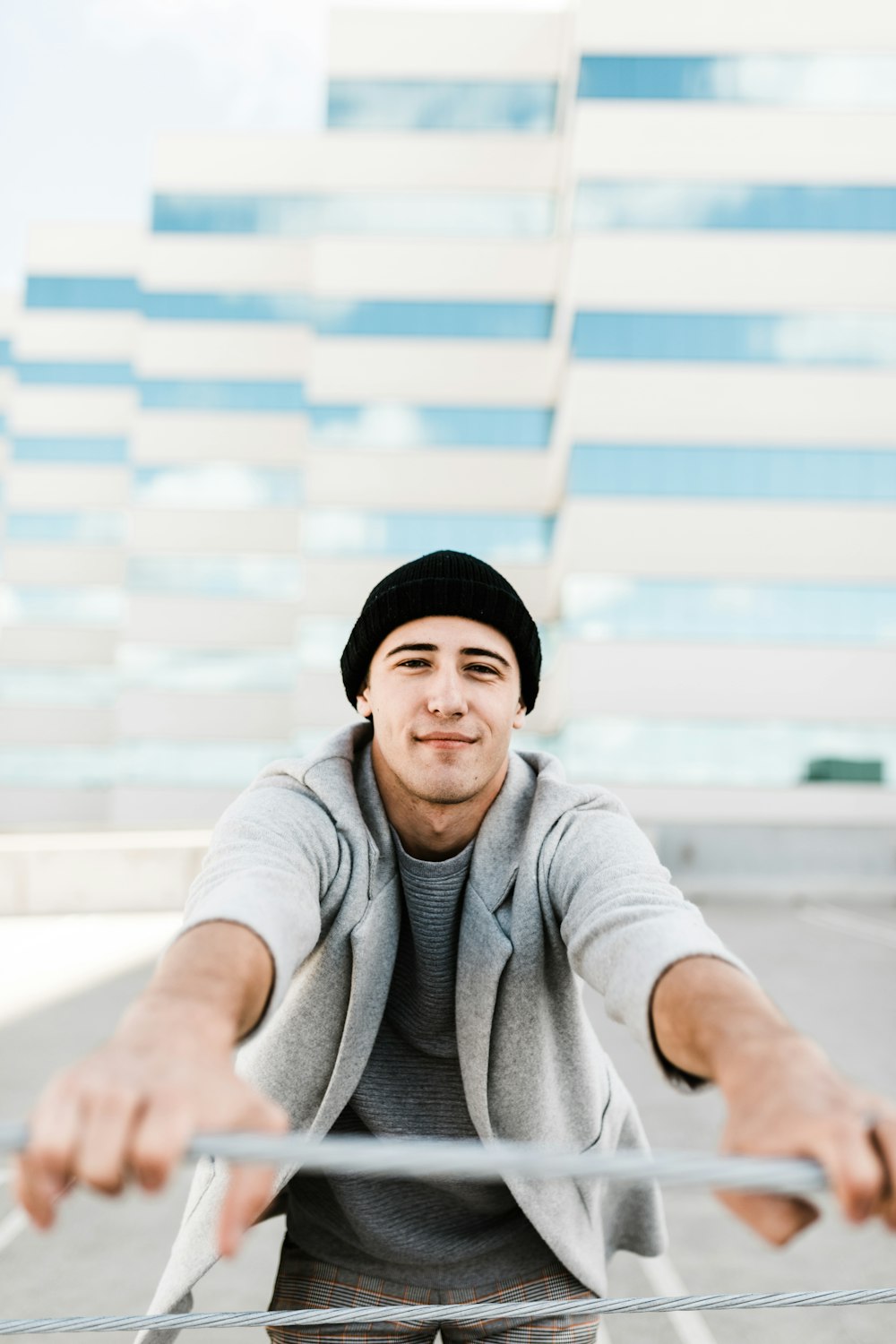 selective focus photo of man holding wire