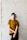 man standing while holding his hand